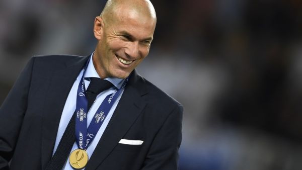 Real Madrid's French coach Zinedine Zidane smiles with his medal after winning the UEFA Super Cup football match between Real Madrid and Manchester United on August 8, 2017, at the Philip II Arena in Skopje.
Dimitar DILKOFF / AFP