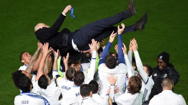 Real Madrid head coach Zinedine Zidane is thrown into the air by Real Madrid players after winning the Club World Cup football final match against Kashima Antlers of Japan at Yokohama International stadium in Yokohama on December 18, 2016.
Toru YAMANAKA / AFP