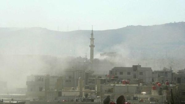 A handout image released by the Syrian opposition's Shaam News Network shows smoke above buildings following what Syrian rebels claim to be a toxic gas attack by pro-government forces in eastern Ghouta, on the outskirts of Damascus on August 21, 2013.  AFP PHOTO / HO / SHAAM NEWS NETWORK. 