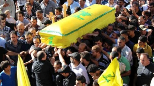 Hezbollah honors its dead fighter, killed in Syria in July, 2013 (Image Ali Dia / AFP)