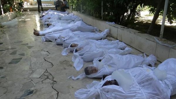 A handout image released by the Syrian opposition's Shaam News Network shows bodies of children wrapped in shrouds as Syrian rebels claim they were killed in a toxic gas attack by pro-government forces in eastern Ghouta, on the outskirts of Damascus on August 21, 2013. AFP PHOTO / HO / SHAAM NEWS NETWORK