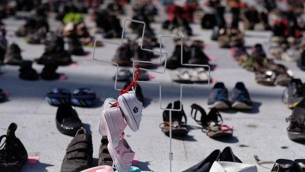 Shoes set aside to represent the thousands who likely died during Hurricane Maria (RICARDO ARDUENGO/AFP)