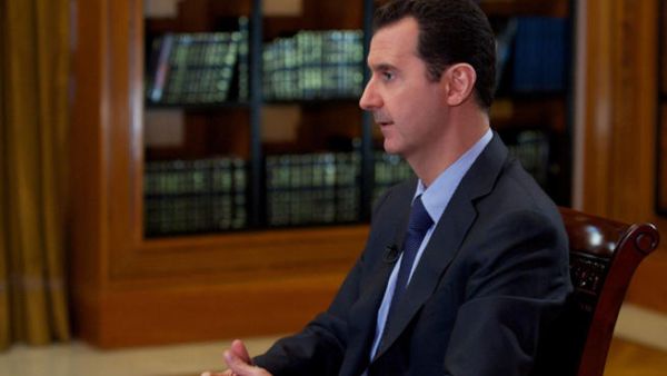 A handout picture released by the official Syrian Arab News Agency (SANA) on October 21, 2013, shows Syrian President Bashar al-Assad giving an interview. (Image credit: AFP)