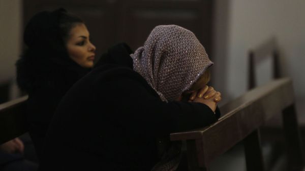 Armenian Iranian Christians pray during a Christmas Eve mass (AFP/FILE)