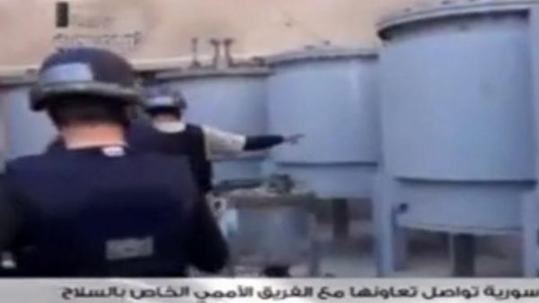  An image grab taken from Syrian television on October 19, 2013 shows inspectors from the Organization for the Prohibition of Chemical Weapons (OPCW) at work at an undisclosed location. (Image credit: AFP)