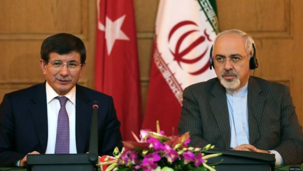 Iranian Foreign Minister Mohammad Javad Zarif  gives a joint press conference with his Turkish counterpart Ahmet Davutoglu on November 27, 2013. [Atta Kenare/AFP]
