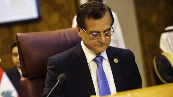 Lebanon foreign affairs minister Adnan Mansour reads during a meeting of the Arab League with Arab countries Foreign ministers on Syria on September 1, 2013 at the body's Cairo headquarters. [Getty Images]