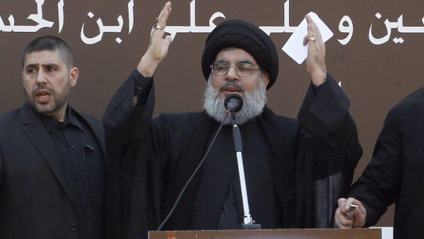 The head of Lebanon's militant Shiite Muslim movement Hezbollah, Hassan Nasrallah gives a speech during a massive Shiite Muslim commemoration in southern Beirut on November 14, 2013. [Getty Images]