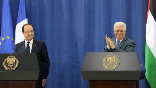 Palestinian President Mahmoud Abbas and French President Francois Hollande hold a joint press conference on November 18, 2013 in Ramallah, West Bank. [Thaer Ghanaim/GPO via Getty Images]