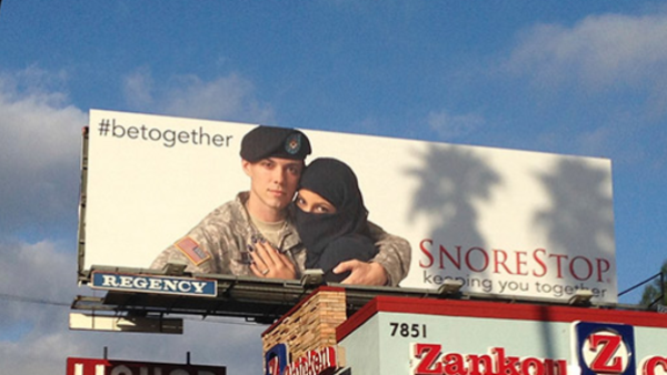 Billboard featuring U.S soldier and a Muslim woman displayed along Sunset Boulevard in Los Angeles. [Alarabyah.net]