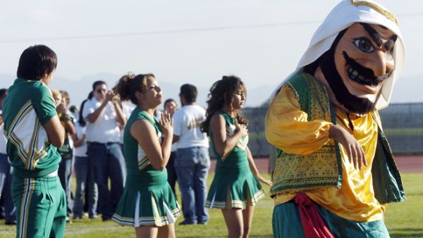 Coachella Valley High School’s mascot dances to the band during a pep rally at the school in Thermal, Calif. [Associated Press]
