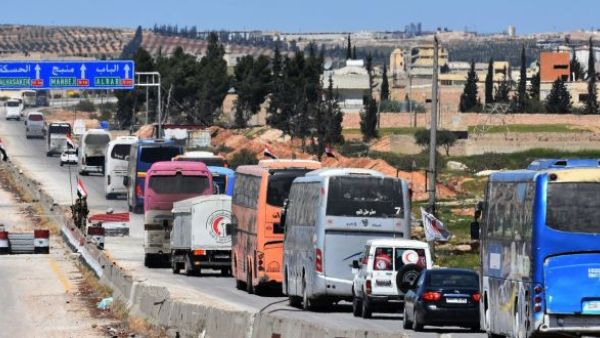 A convoy transporting Jaish al-Islam fighters and their families from the town of Douma to the northern Syrian city of Aleppo. (AFP/ File)