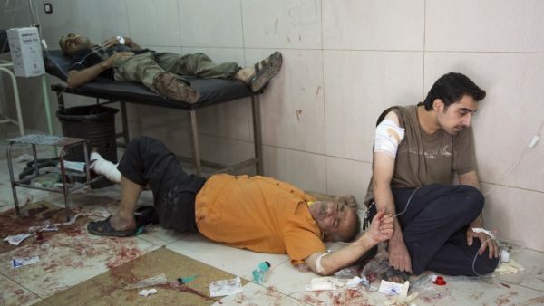 Patients wait for treatment in a hospital in eastern Aleppo during the siege of 2016. (AFP/File)