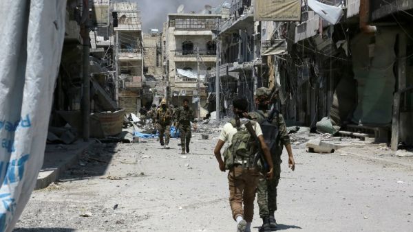 Members of the Syrian Democratic Forces (SDF) patrol a street in the northern Syrian town of Manbij on August 7, 2016, as they comb the city in search of the last remaining militants, a day after they retook it from Daesh. (AFP/Delil Souleiman)
