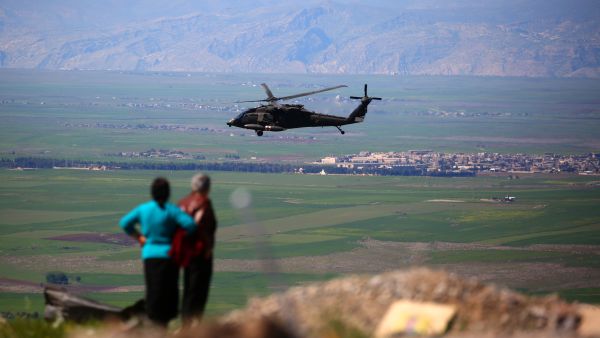 A medical helicopter from the US-led coalition flies near the Syrian Kurdish town of Derik, April 25 2017. (AFP/Delil Souleiman)