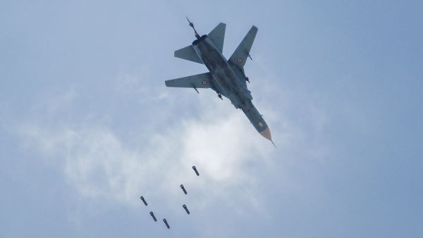 A Syrian government forces' MiG-23 fighter-bomber drops a payload during a reported air strike in the rebel-held area of Qabun, east of the capital Damascus, on May 6, 2017. (AFP/Amer Almohibany)