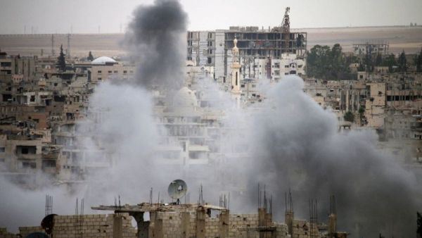 Smoke rises from buildings in a rebel-held neighbourhood of Daraa in southern Syria. (AFP/ File)