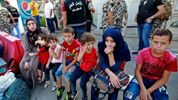 Syrian refugees gather as they prepare to leave the Lebanese capital Beirut, before their journey to return home to Syria on September 4, 2018. (AFP /ANWAR AMRO)