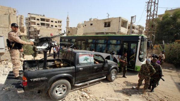 The 15th convoy carrying civilians and opposition fighters has arrived in Aleppo’s Al-Bab district. (AFP/ File Photo)