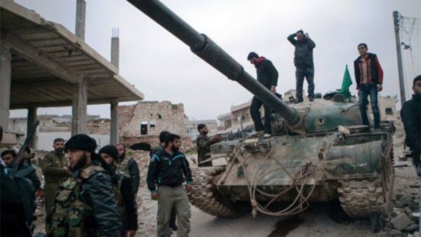 A file photo of Syrian rebels gather around a T-72 tank, captured from government forces. (AFP)