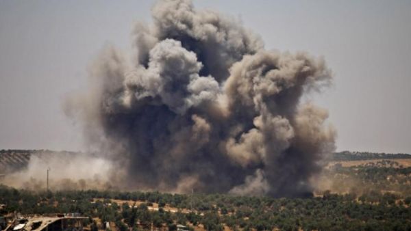 Smoke rises above opposition held areas of Daraa during airstrikes by Syrian regime forces on June 26, 2018. (Mohamad ABAZEED/AFP)