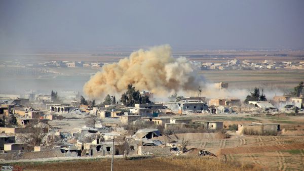 Smoke rises from buildings in the area of Tal Sharba following government air strikes on the outskirts of the northern Syrian city of Aleppo on December 27, 2015. (AFP)