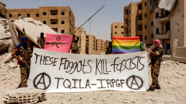 "These Faggots Kill Fascists! We shoot back! The Black & Pink and Rainbow flag fly in Raqqa. #Queers smashing the Caliphate" this photo was captioned on Twitter (IRPGF)