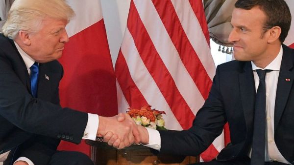 Footage of a handshake between US President Donald Trump and French counterpart Emmanuel Macron ahead of a NATO summit. (AFP/Mandel NGAN)