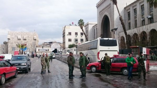 Syrian security forces cordon off the area following a reported suicide bombing at the old palace of justice building in Damascus on March 15, 2017. (AFP/Stringer)