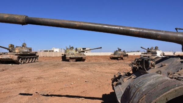 Syrian army tanks are positioned on the eastern outskirts of the northern Syrian city of Aleppo on February 17, 2017. (AFP/George Ourfalian)