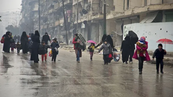 Under the hail of bullets, women and children hurry to leave one of the areas in south Damascus fought over by regimes forces and opposition groups, (AFP/ File Photo) 