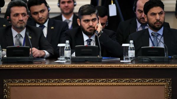 Chief opposition negotiator Mohammad Alloush (C) of the Jaish al-Islam (Army of Islam) rebel group attends the first session of Syria peace talks at Astana's Rixos President Hotel on January 23, 2017. (AFP/Kiril Kudryatsev)