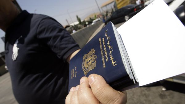 Many Syrians left the country illegally, making them unable to renew their passports and leaving them trapped in their host countries. (AFP/File)