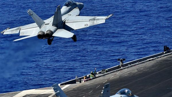 An F-18 takes off from the US Navy's USS Dwight D. Eisenhower to carry out air strikes on 7 July 2016. (AFP)