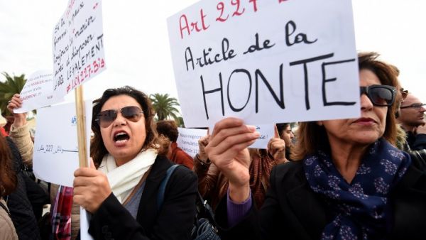 Tunisian women protest an article of their penal code which allowed rapists to marry their victims (AFP)