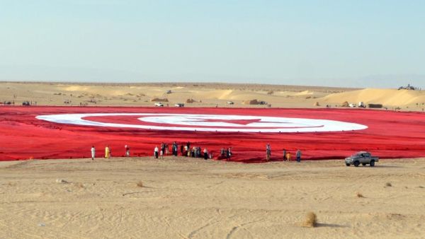 The flag is the size of 19 football pitches.(AFP Photo/Saif Trabelsi)