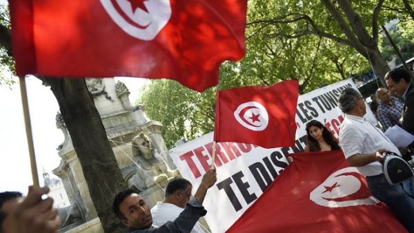 Protesters wave Tunisian flags during a demonstration against terrorism in Paris on June 27, 2015, a day after a deadly attack on a Tunisian beach resort. (Loic Venance/ AFP) Protesters wave Tunisian flags during a demonstration against terrorism in Paris on June 27, 2015, a day after a deadly attack on a Tunisian beach resort. (Loic Venance/ AFP)