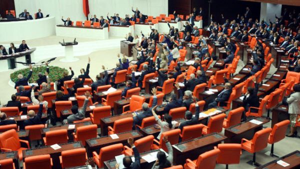 Turkish deputies convene on October 3, 2013 at the Parliament in Ankara to discuss a motion to the parliament asking for authorization to send troops to Syria. (Image credit: AFP)