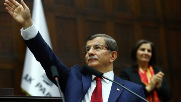 Turkish Prime Minister and leader of Turkey's ruling party, the Justice and Development Party (AKP) Ahmet Davutoglu greets members of parliament on May 03, 2016. (AFP/Adem Altan)