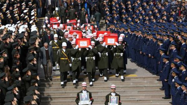Honor guards carry the coffins of eight victims of the terror attack at Friday's funerals at Ankara's Kocatepe Mosque. (AFP/File)
