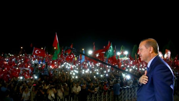 Turkish President Recep Tayyip Erdogan addresses people gathered at the Presidential Complex to protest the July 15th failed military coup attempt in Ankara, Turkey on August 10, 2016. (AFP/Kayhan Ozer)