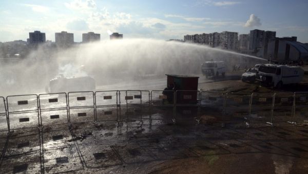 Turkish riot police use water cannons on February 9, 2016 in Diyarbakir, southeastern Turkey, during the Ziraat Turkish Cup football match after a Kurdish player was suspended. (AFP/Ilyas Akengin)