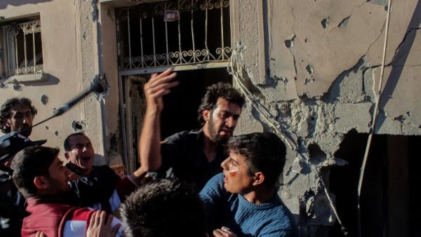 Relatives of injured people react at the site after a rocket hit a house on May 5, 2016 in Kilis. (AFP/Stringer)