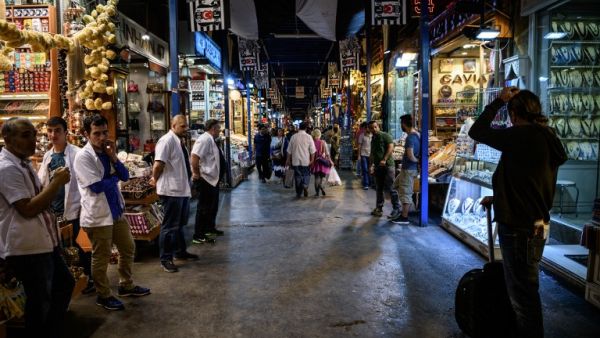 People walk inside the spice bazaar in Eminonu district, in Istanbul on June 9, 2016. (AFP/Ozan Kose)