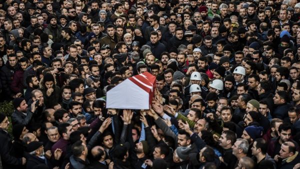 People carry the coffin of Yunus Gormek, 23, one of the victims of the Reina night club attack, during his funeral ceremony on January 2, 2017 in Istanbul. (AFP/Bulent Kilic)