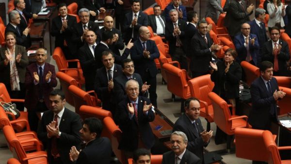 Legislators of the main opposition Republican People's Party (CHP), applaud in protest during the second tour debating a reform of the constitution, at the Turkish parliament in Ankara on January 18, 2017. (AFP/Adem Altan)