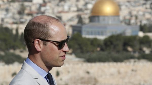 Britain's Prince William stands in Jerusalem's Mount of Olives overlooking the Old City with the golden dome of the Dome of the Rock mosque on June 28, 2018. (Thomas COEX / POOL / AFP)