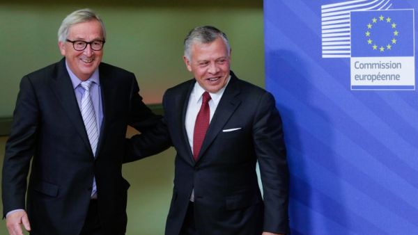 President of the European Commission Jean Claude Juncker (L) welcomes Jordanian King Abdullah II (R) at the European Commission headquarters in Brussels, ahead of a meeting on December 12, 2018. (AFP)