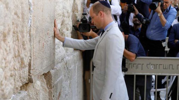Britain's Prince William touches the Western Wall, the holiest site where Jews can pray, in Jerusalem's Old City today. (AFP/ File)