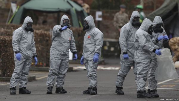 Military personnel wearing protective coveralls work behind a police station in Salisbury following an attack on a former Russian spy by a nerve agent. (AFP/ File Photo)